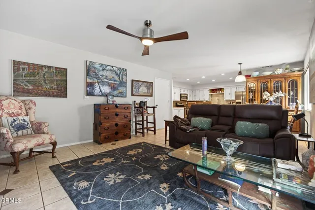 a living room with furniture and a rug