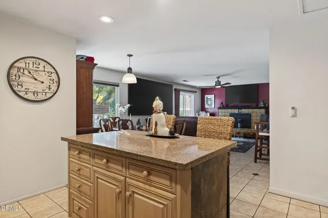 a view of living room with furniture and a clock