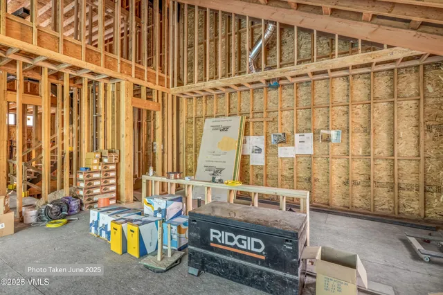 a view of a patio with table and chairs and potted plants