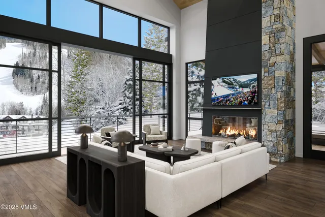 a balcony with furniture and a floor to ceiling window