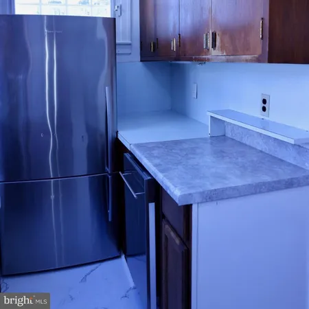 a kitchen with a sink cabinets and window