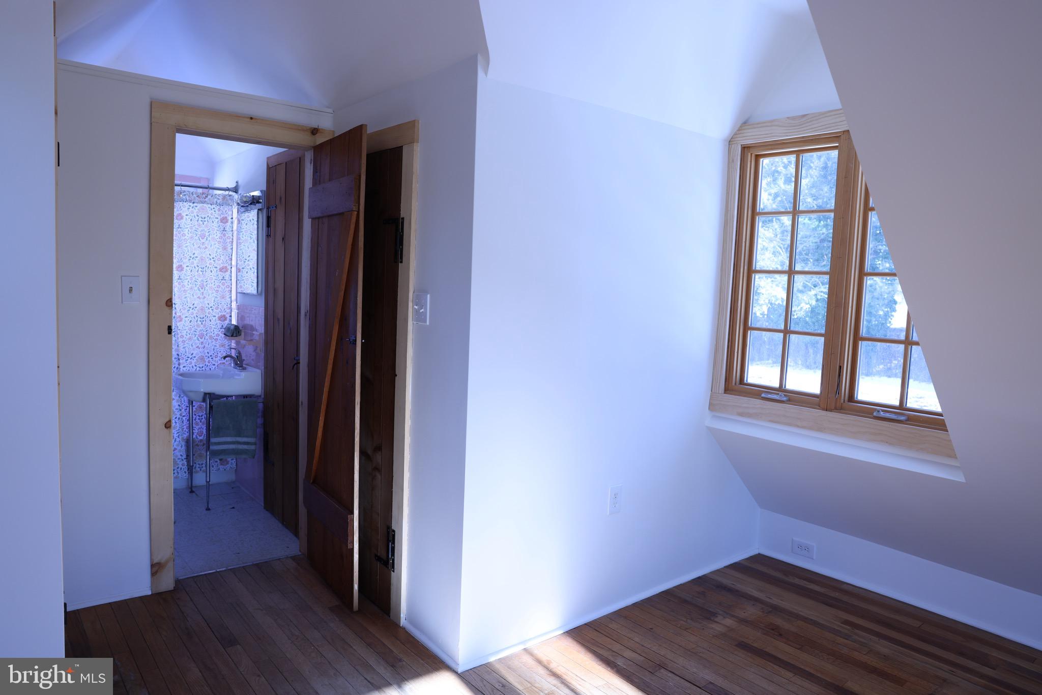 2598 River Road New Hope, PA 18938 - Photo 19 of 24 wooden floor in an empty room with a window