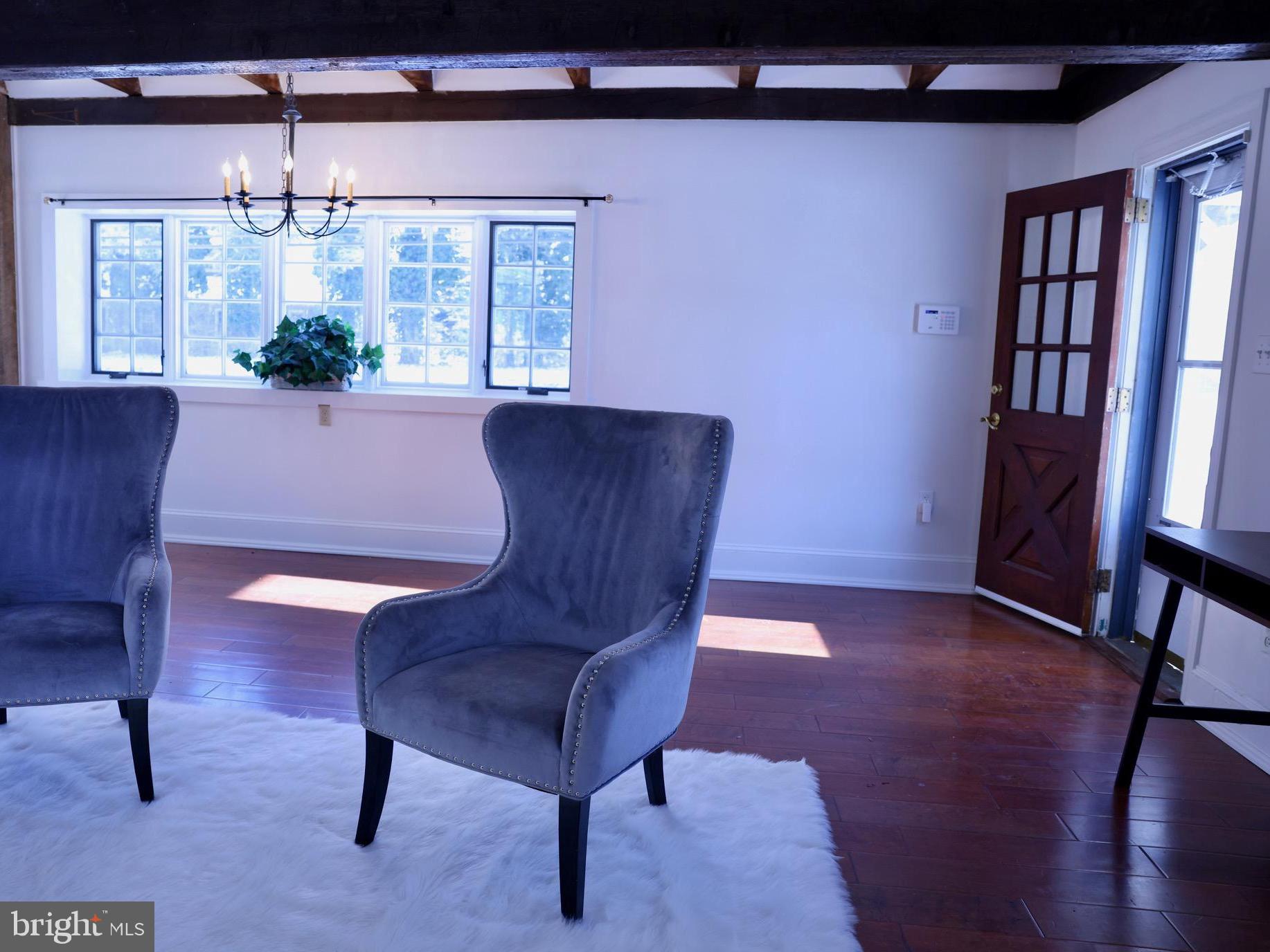 2598 River Road New Hope, PA 18938 - Photo 5 of 24 a living room with furniture and a chandelier