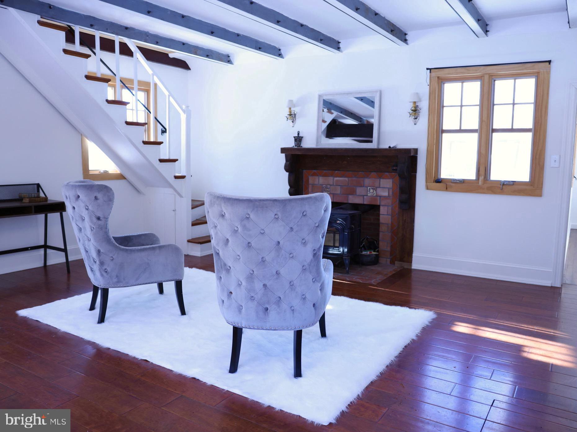 2598 River Road New Hope, PA 18938 - Photo 6 of 24 a living room with furniture and a fireplace