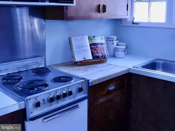 a kitchen with a stove and a microwave