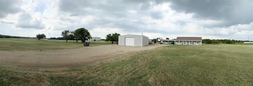 12638 Highway 82 Savoy, TX 75479 - Photo 1 of 21 a view of a big yard with beach and barbeque oven