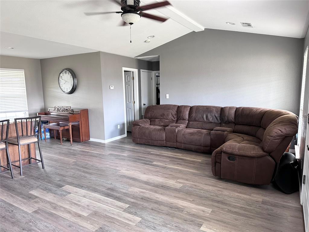 12638 Highway 82 Savoy, TX 75479 - Photo 11 of 21 a living room with furniture and a wooden floor
