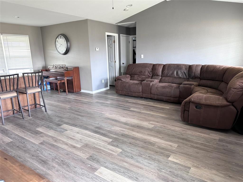 12638 Highway 82 Savoy, TX 75479 - Photo 12 of 21 a living room with furniture and a wooden floor