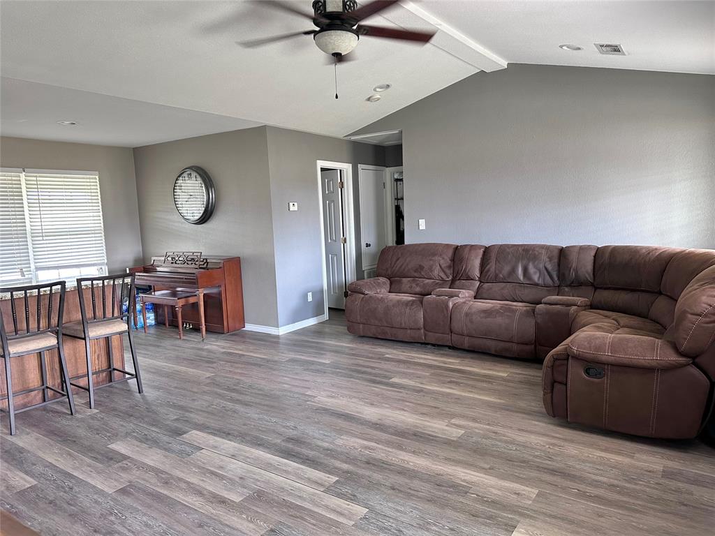 12638 Highway 82 Savoy, TX 75479 - Photo 13 of 21 a living room with furniture and a wooden floor