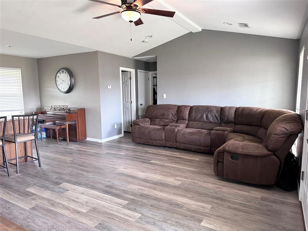 12638 Highway 82 Savoy, TX 75479 - Photo 15 of 21 a living room with furniture and a wooden floor