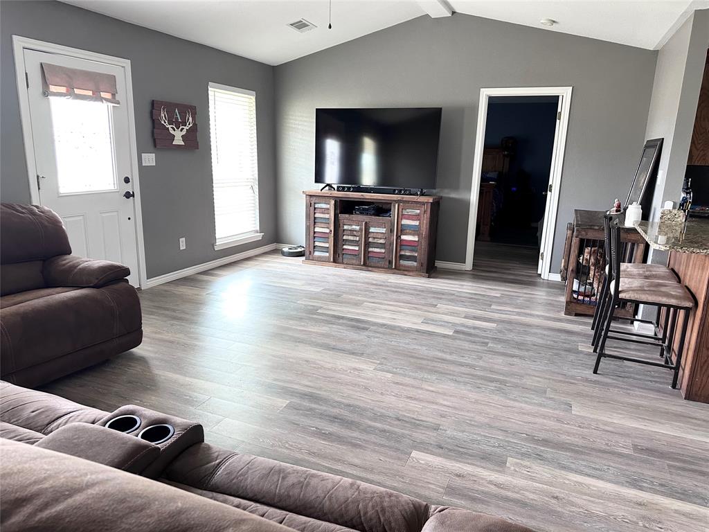 12638 Highway 82 Savoy, TX 75479 - Photo 10 of 21 a living room with furniture and a flat screen tv