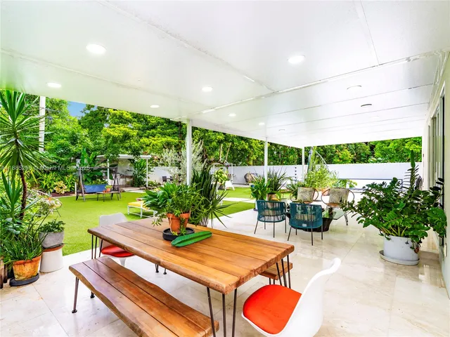 a outdoor dining space with furniture and garden