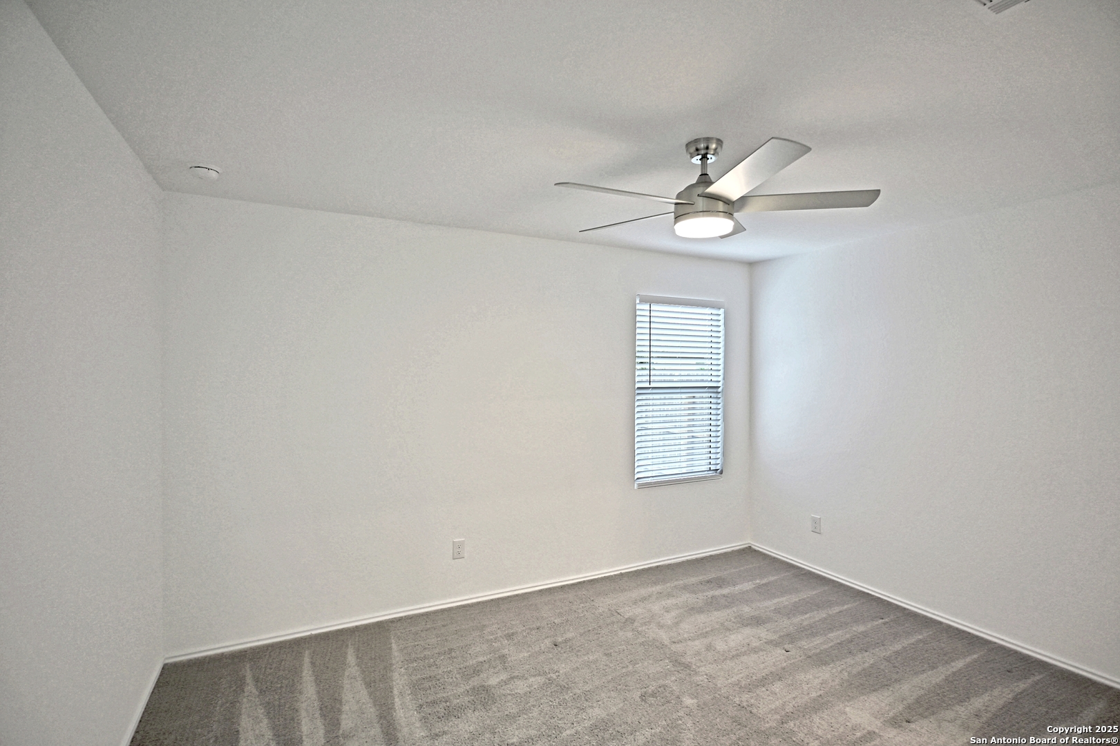 5925 San Geronimo Seguin, TX 78155 - Photo 15 of 29 an empty room with windows and fan