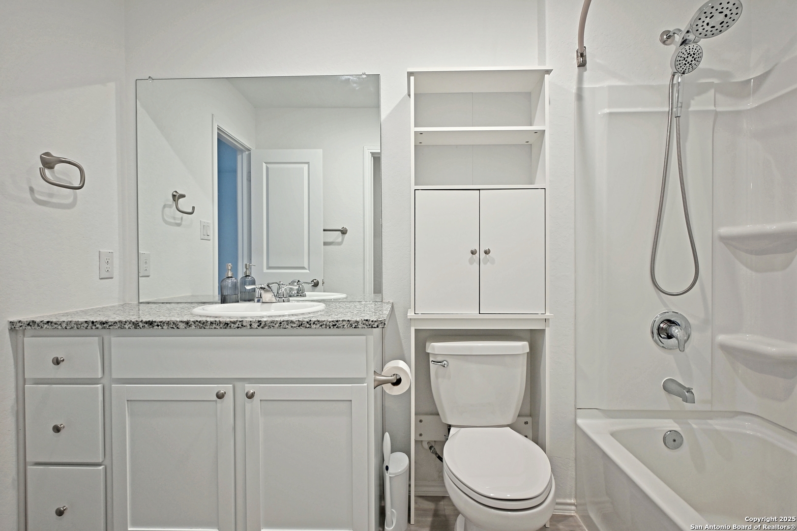 5925 San Geronimo Seguin, TX 78155 - Photo 18 of 29 a bathroom with a granite countertop sink a toilet and shower