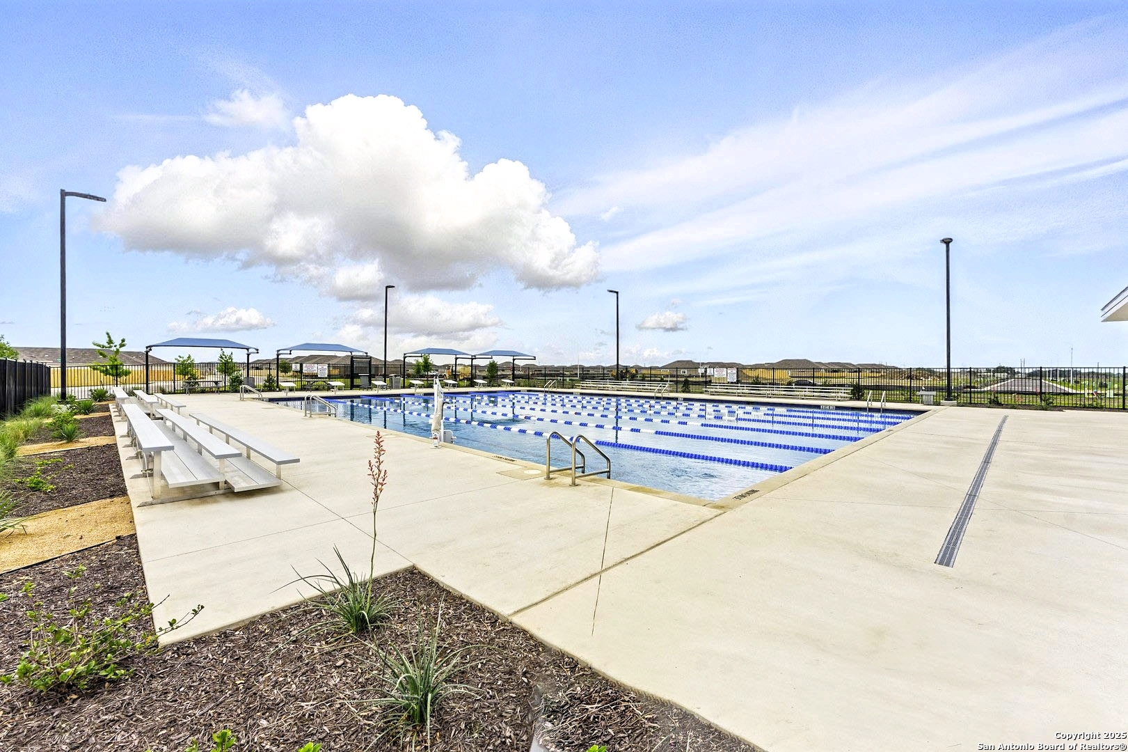 5925 San Geronimo Seguin, TX 78155 - Photo 25 of 29 a view of a swimming pool with a lounge chairs