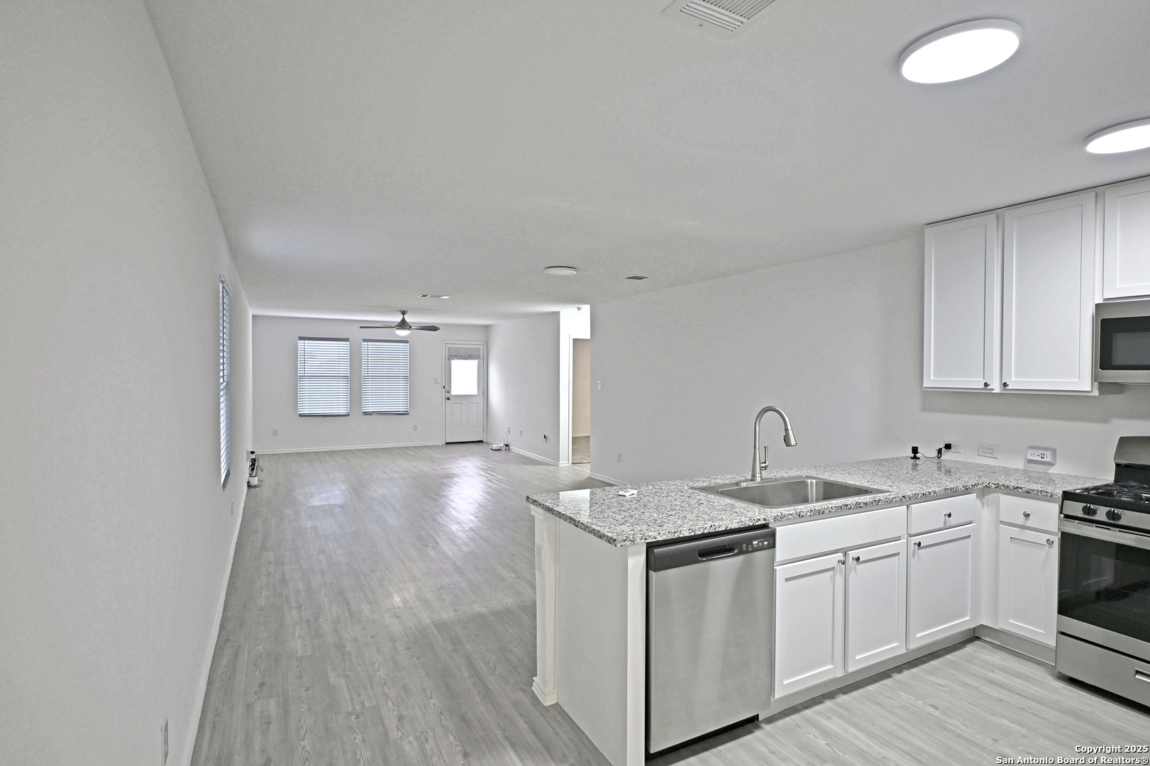 5925 San Geronimo Seguin, TX 78155 - Photo 3 of 29 a kitchen with a sink stove and cabinets