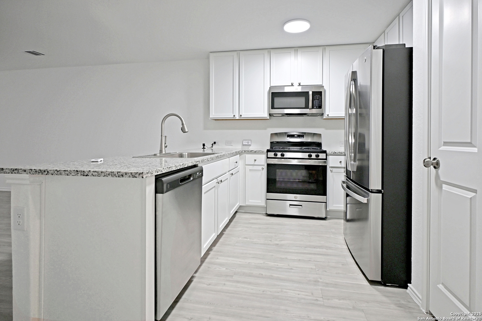 5925 San Geronimo Seguin, TX 78155 - Photo 4 of 29 a kitchen with stainless steel appliances granite countertop a stove top oven a refrigerator and a stove