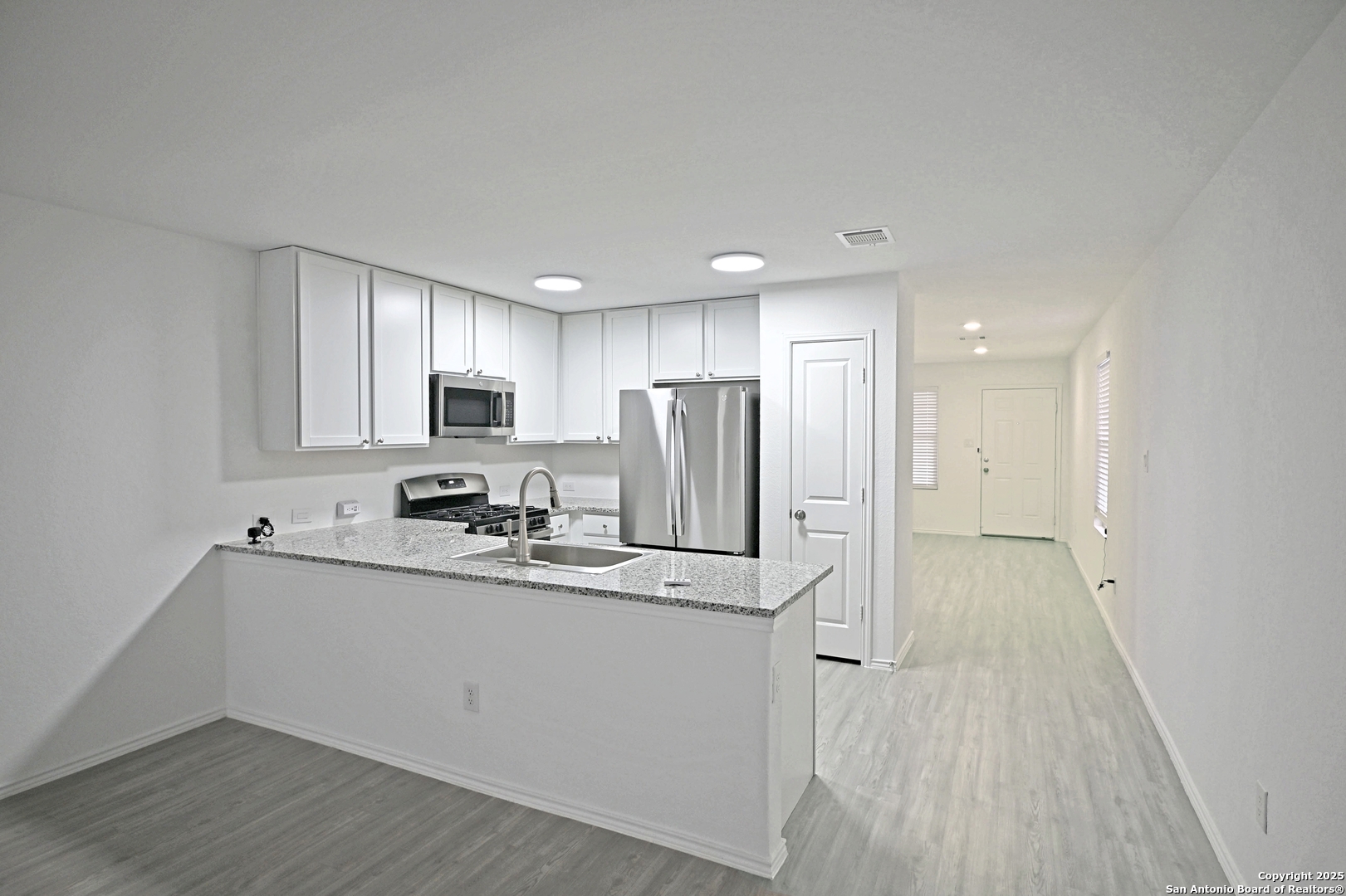 5925 San Geronimo Seguin, TX 78155 - Photo 5 of 29 a kitchen with stainless steel appliances granite countertop a sink refrigerator and cabinets