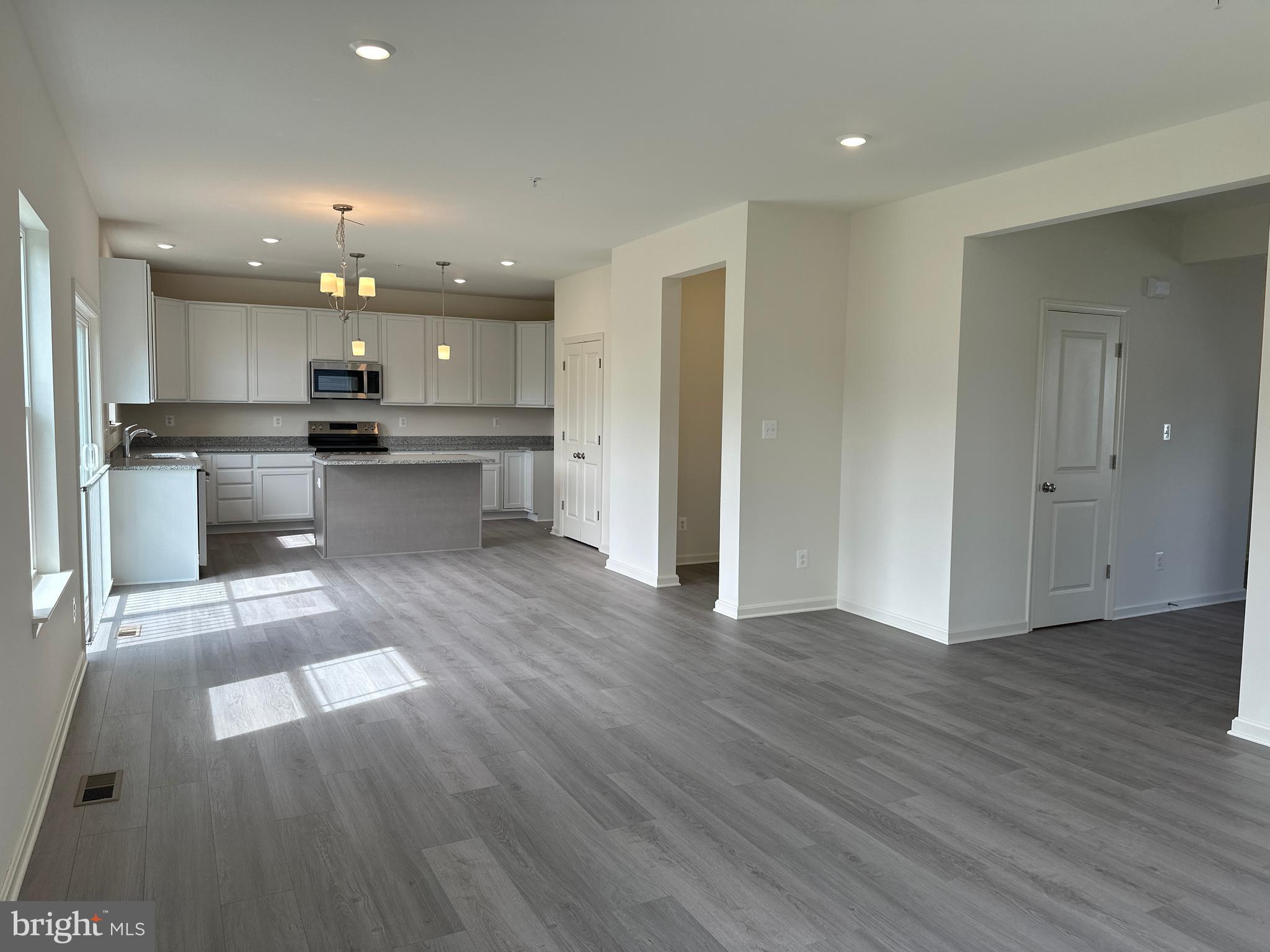 60 Chase Circle Elkton, MD 21921 - Photo 17 of 48 an open kitchen with a sink and stainless steel appliances
