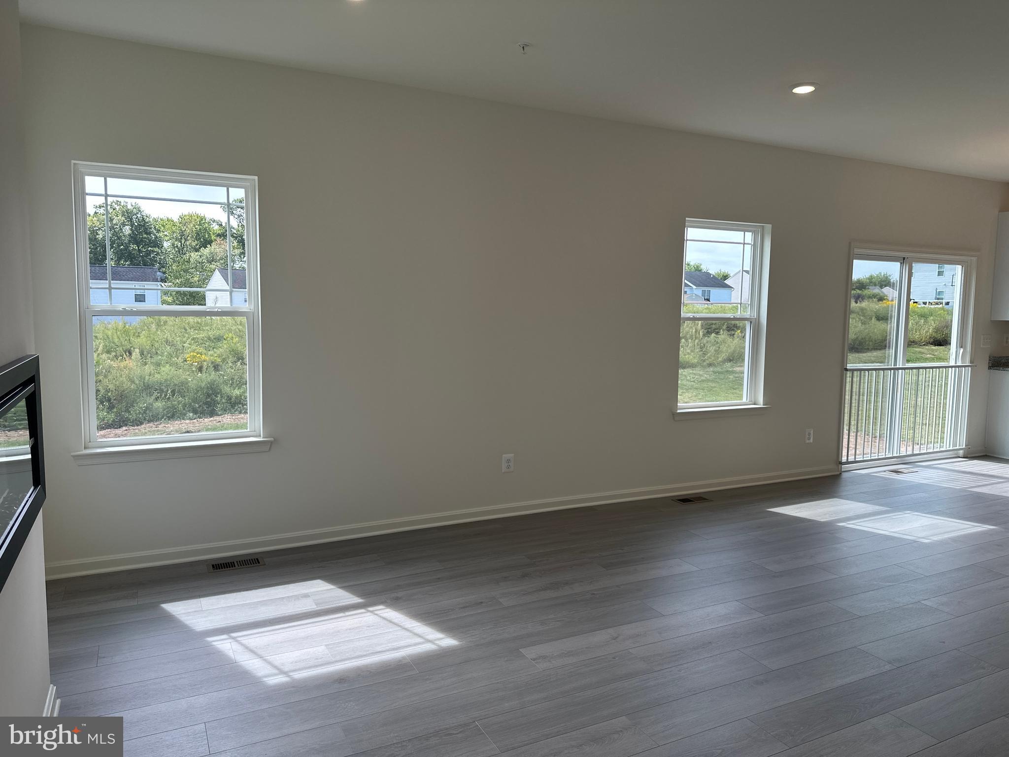 60 Chase Circle Elkton, MD 21921 - Photo 19 of 48 an empty room with wooden floor and windows