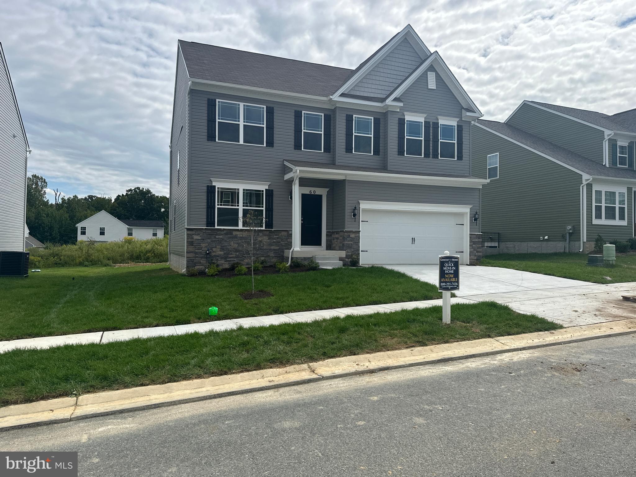 60 Chase Circle Elkton, MD 21921 - Photo 2 of 48 a front view of a house with a yard and garage
