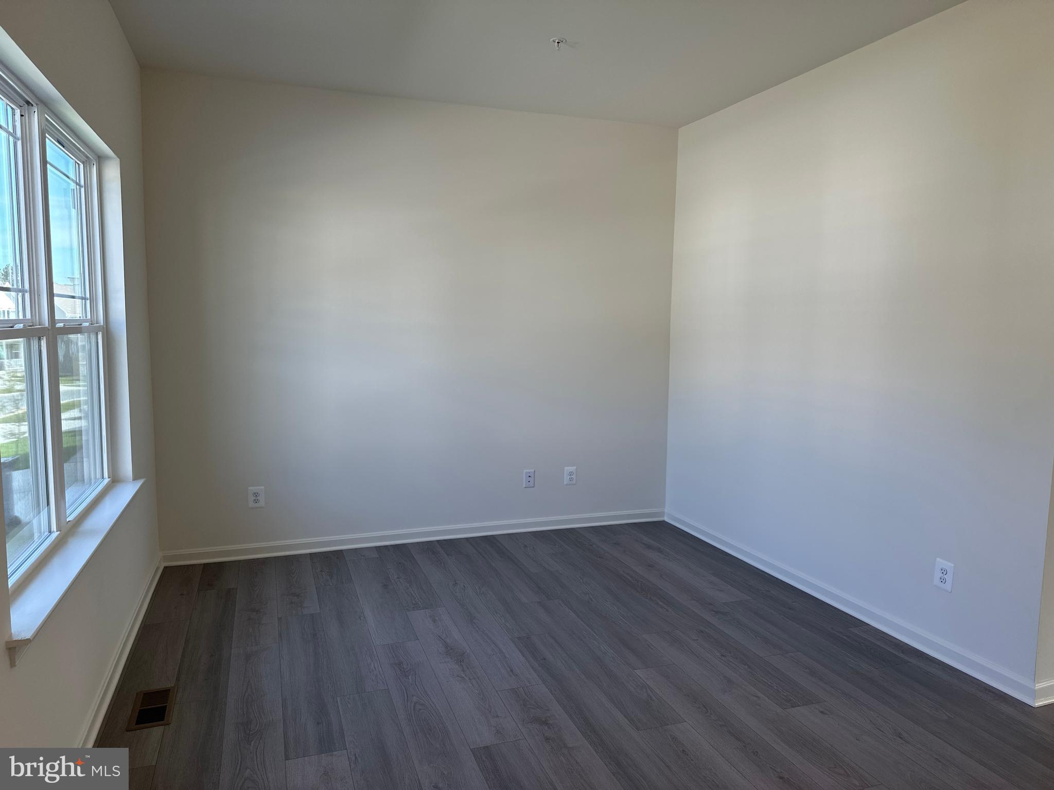60 Chase Circle Elkton, MD 21921 - Photo 5 of 48 an empty room with wooden floor and windows