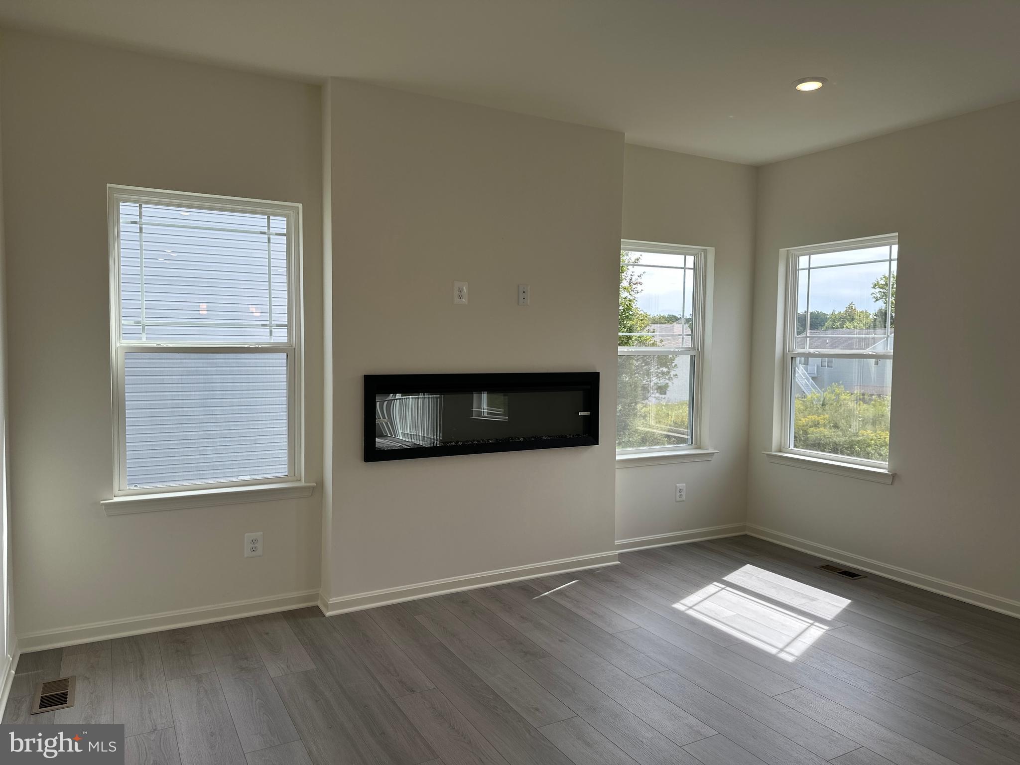 60 Chase Circle Elkton, MD 21921 - Photo 9 of 48 a view of an empty room with wooden floor and a window