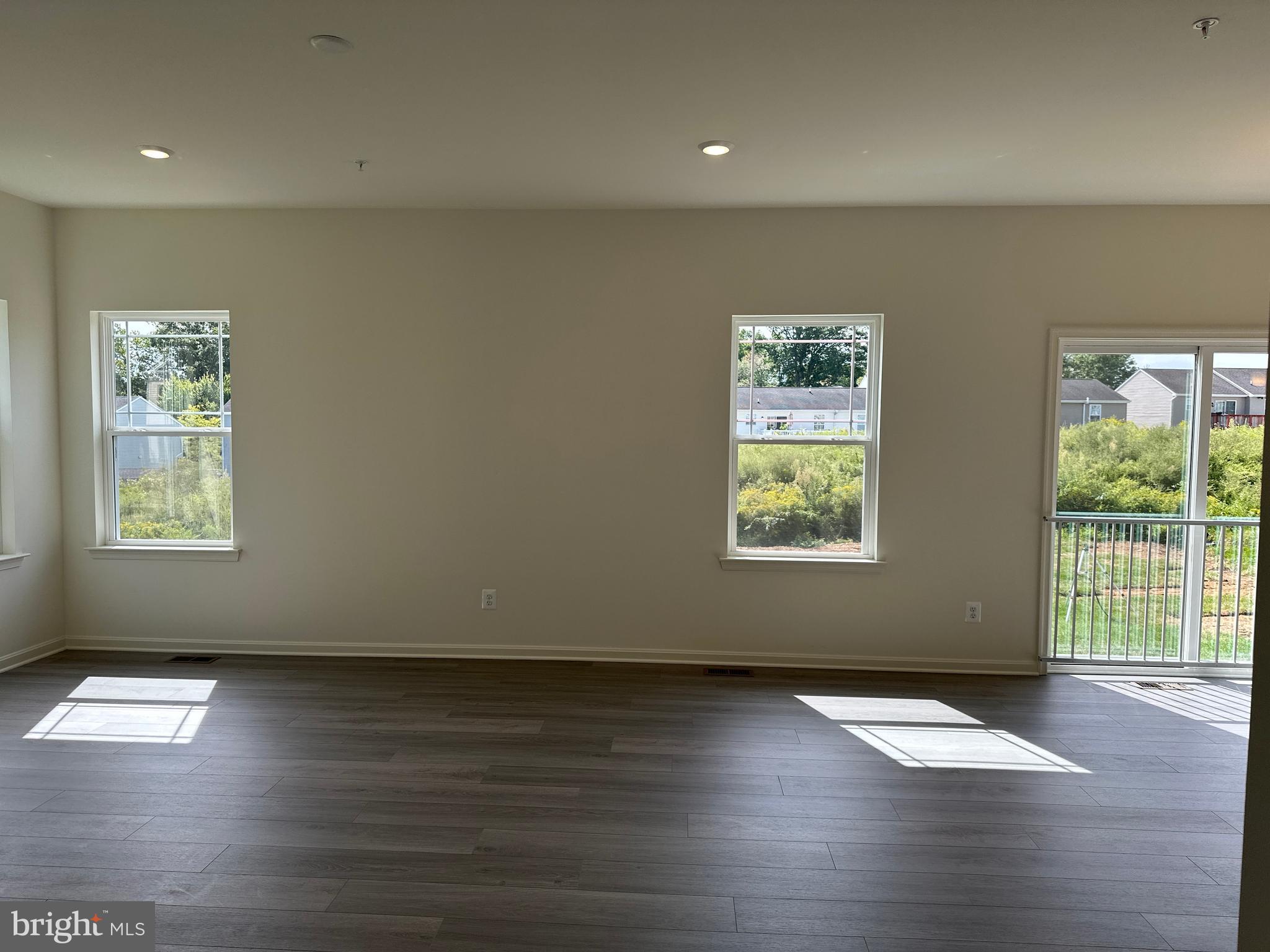 60 Chase Circle Elkton, MD 21921 - Photo 10 of 48 an empty room with wooden floor and windows