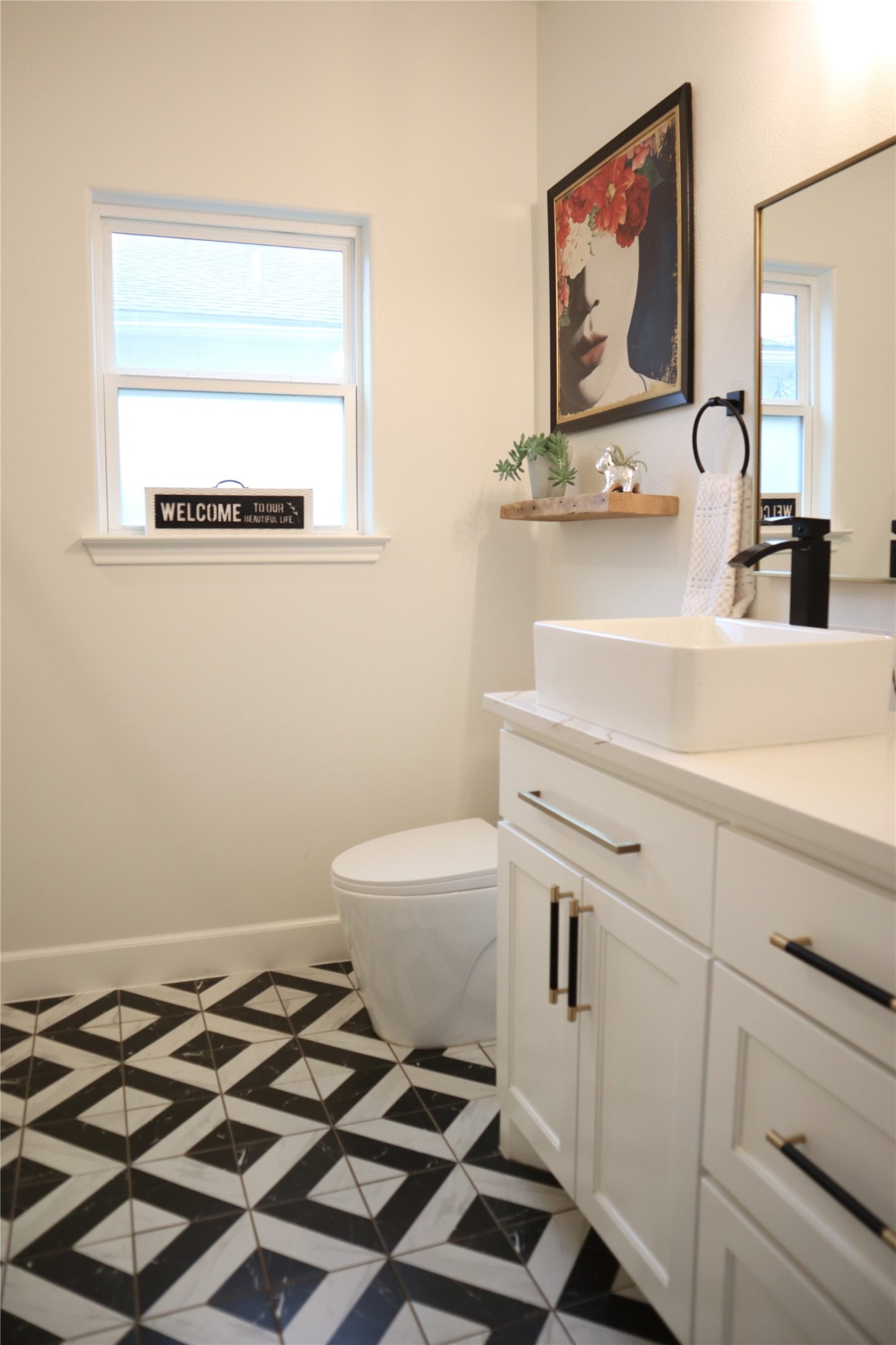20602 Oak Ridge Lago Vista, TX 78645 - Photo 23 of 35 Striking geometric floor tile anchors this contemporary powder room with its sleek vanity.