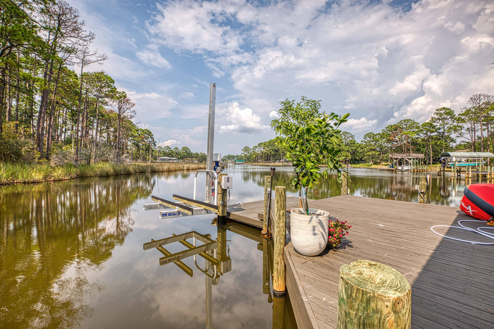 160 Grand Flora Way Santa Rosa Beach, FL 32459 - Photo 23 of 51 a view of a lake with couches chairs