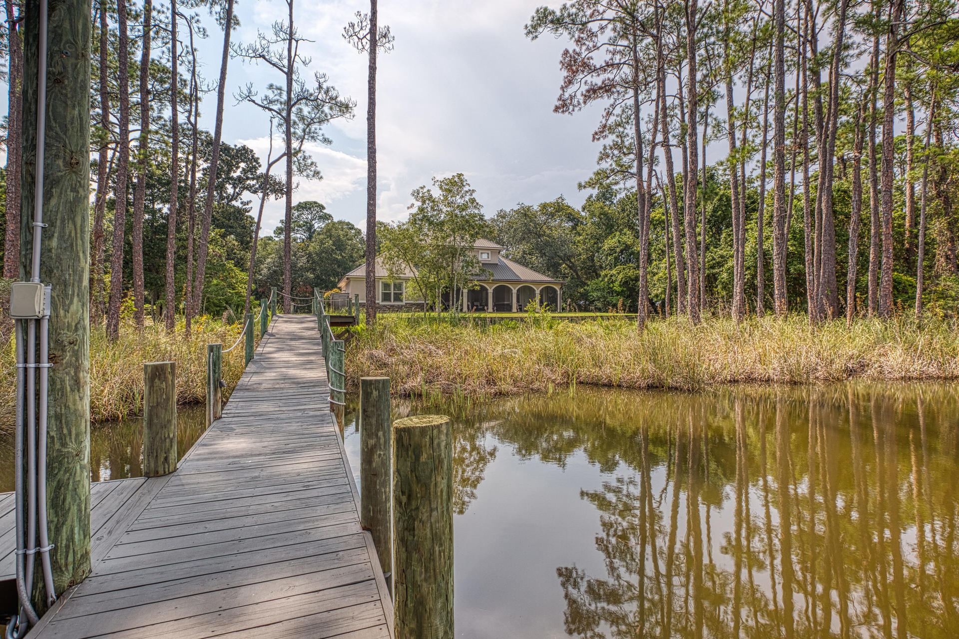 160 Grand Flora Way Santa Rosa Beach, FL 32459 - Photo 24 of 51 a view of a lake with a large building in the background