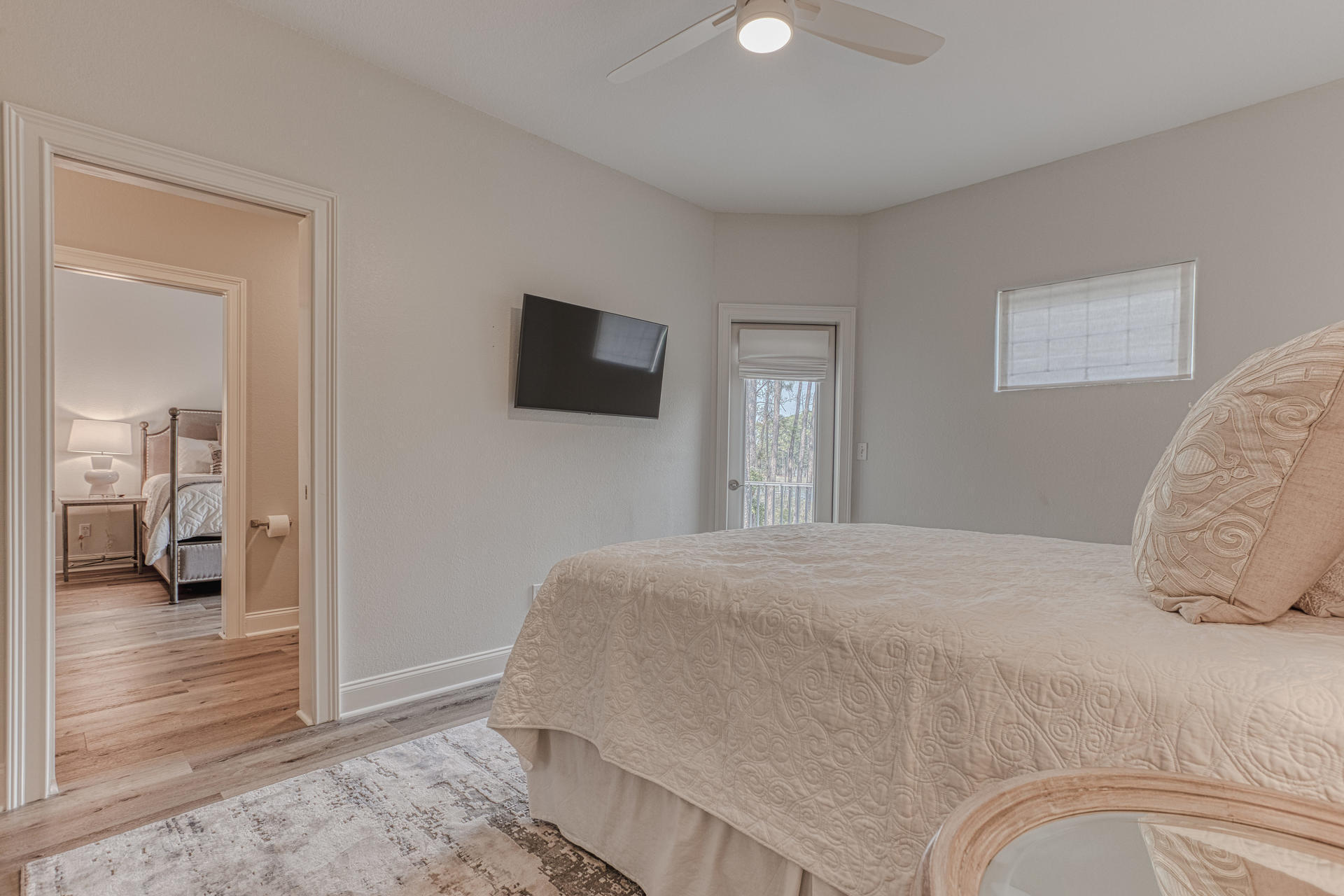 160 Grand Flora Way Santa Rosa Beach, FL 32459 - Photo 35 of 51 a bedroom with a bed and a flat screen tv