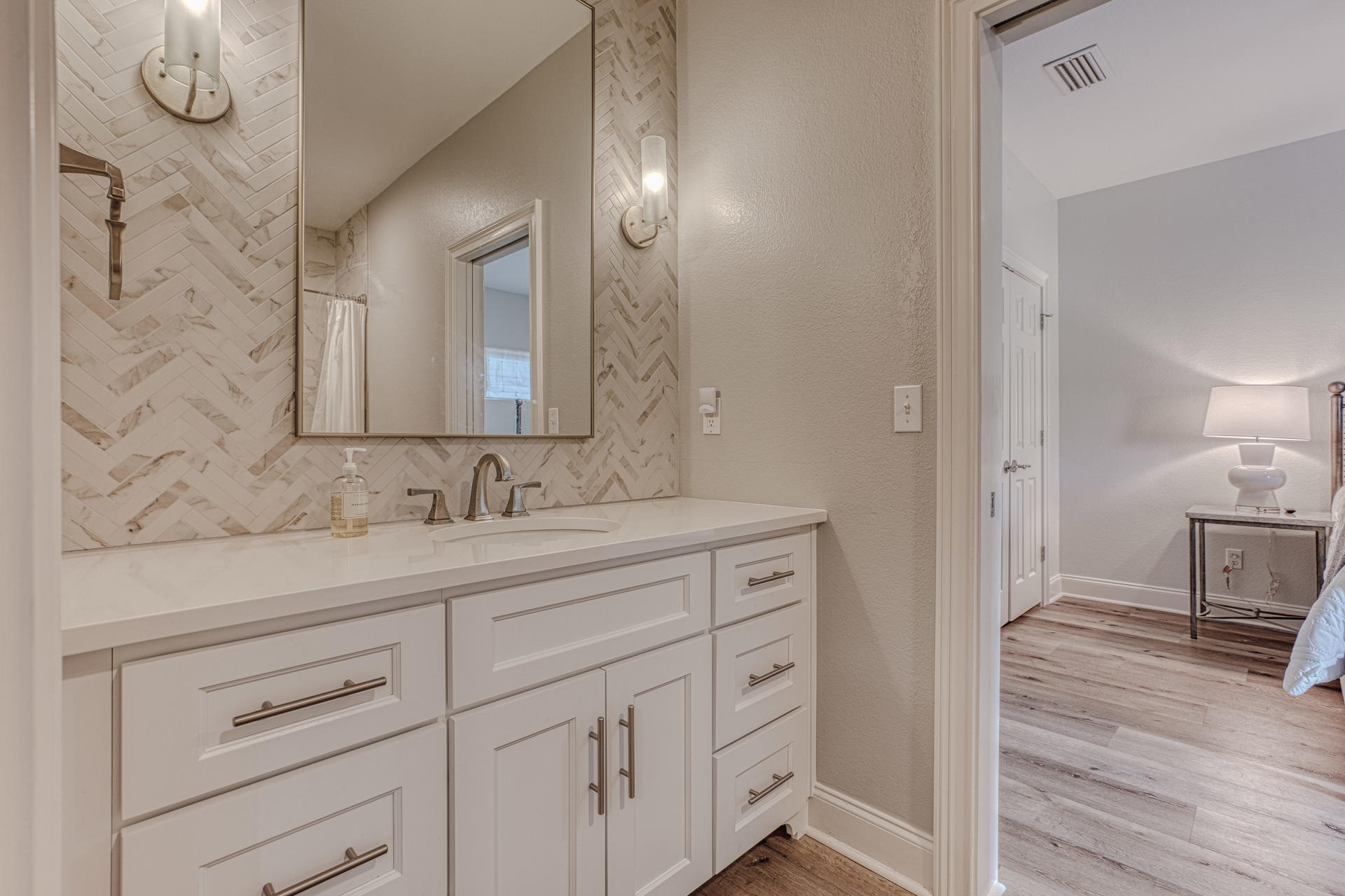 160 Grand Flora Way Santa Rosa Beach, FL 32459 - Photo 36 of 51 a en suite bathroom with a granite countertop sink and a mirror