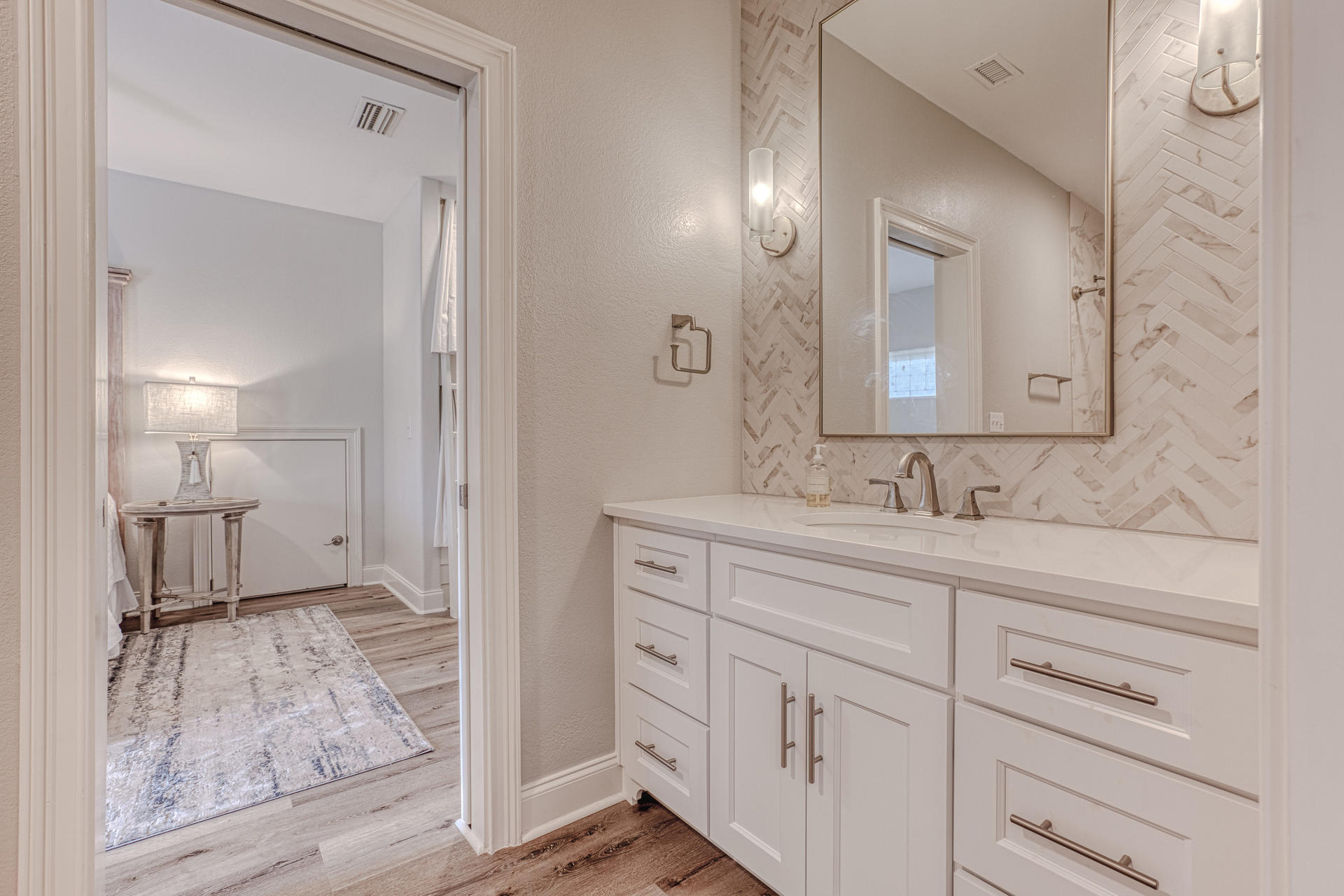 160 Grand Flora Way Santa Rosa Beach, FL 32459 - Photo 38 of 51 a spacious bathroom with a sink and a mirror