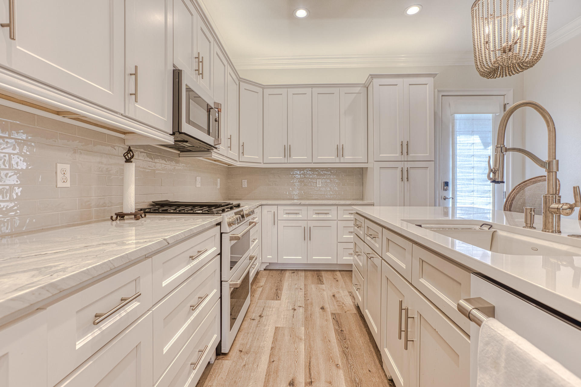 160 Grand Flora Way Santa Rosa Beach, FL 32459 - Photo 6 of 51 a kitchen with stainless steel appliances granite countertop a sink dishwasher a stove and cabinets with wooden floor