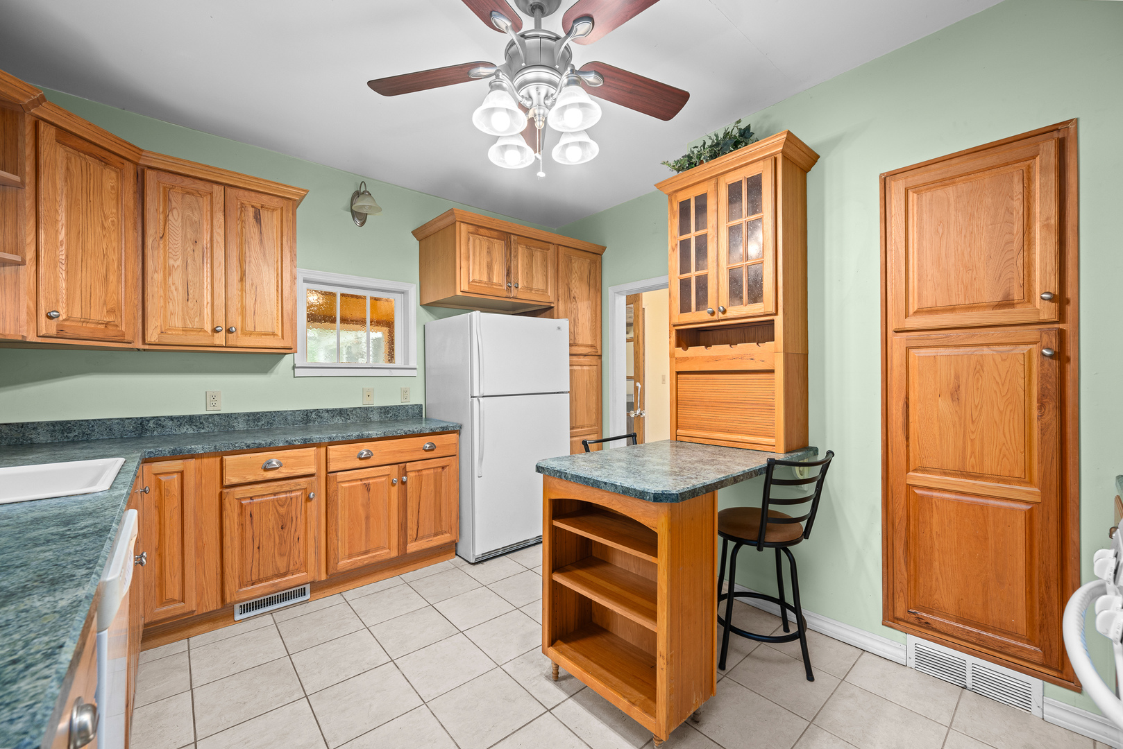 802 North High Street Port Byron, IL 61275 - Photo 19 of 43 a kitchen with stainless steel appliances granite countertop cabinets and a refrigerator