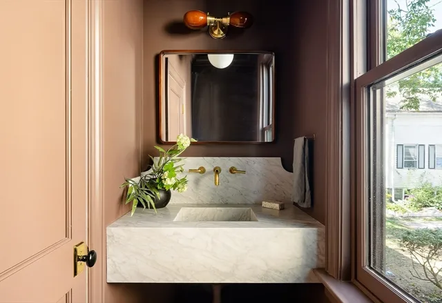 a bathroom with a sink and mirror