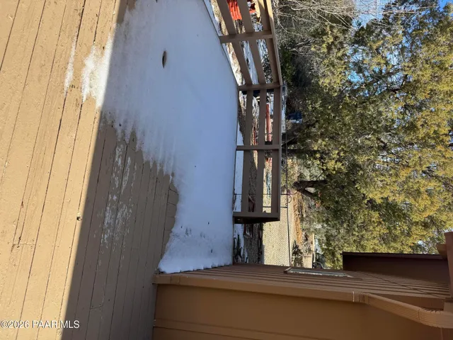 a view of an empty room with furniture and closet