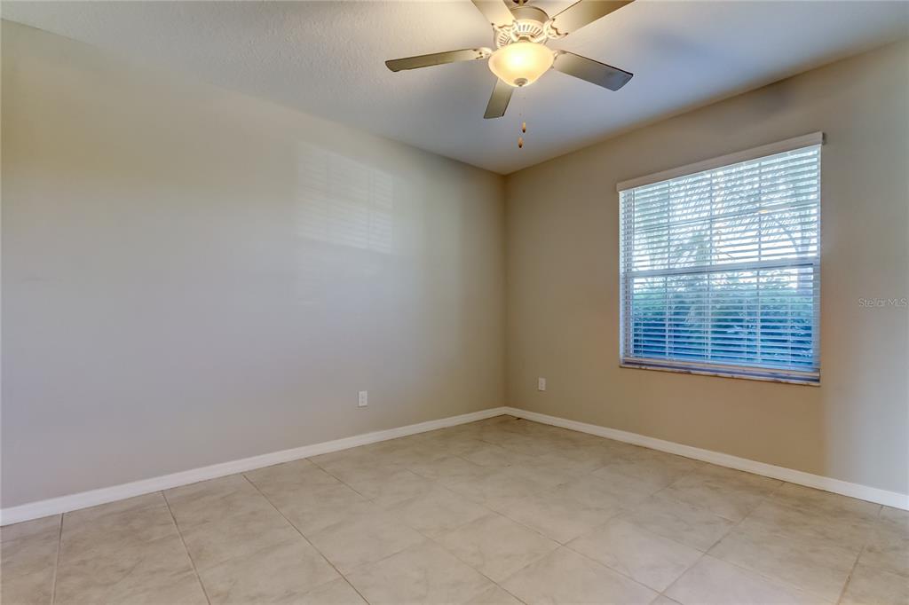 6362 Spider Lily Way New Port Richey, FL 34653 - Photo 11 of 47 a view of an empty room with a window