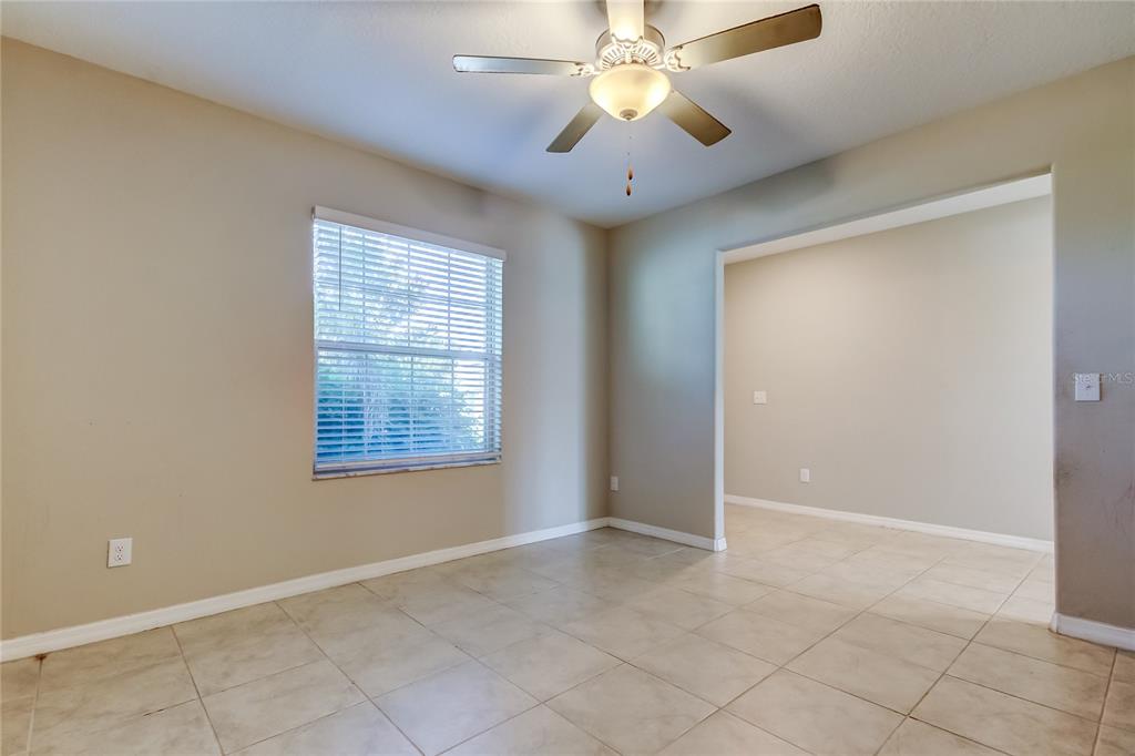 6362 Spider Lily Way New Port Richey, FL 34653 - Photo 12 of 47 a view of an empty room with a window