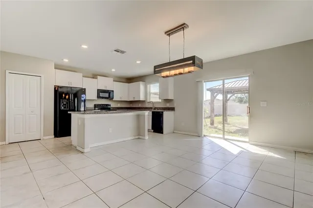 a large kitchen with cabinets