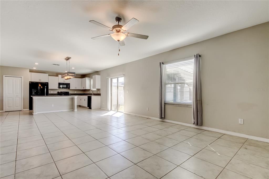6362 Spider Lily Way New Port Richey, FL 34653 - Photo 24 of 47 a view of an empty room with a window