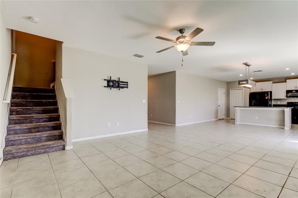6362 Spider Lily Way New Port Richey, FL 34653 - Photo 25 of 47 a view of a livingroom with a fireplace