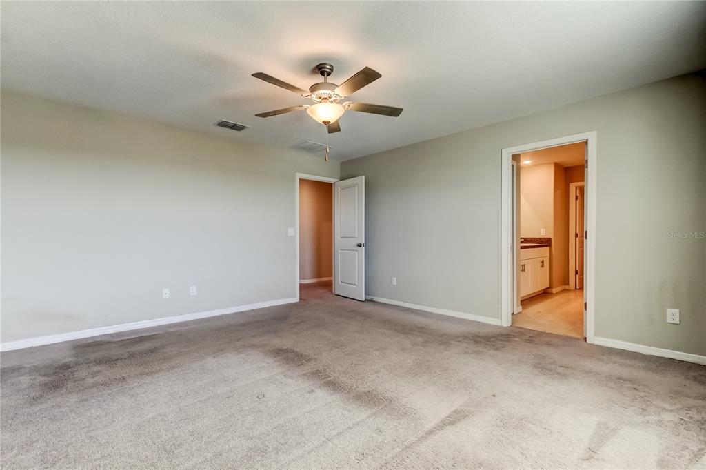 6362 Spider Lily Way New Port Richey, FL 34653 - Photo 30 of 47 a view of an empty room with a window