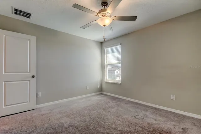 a bathroom with a granite countertop sink a toilet and a bathtub
