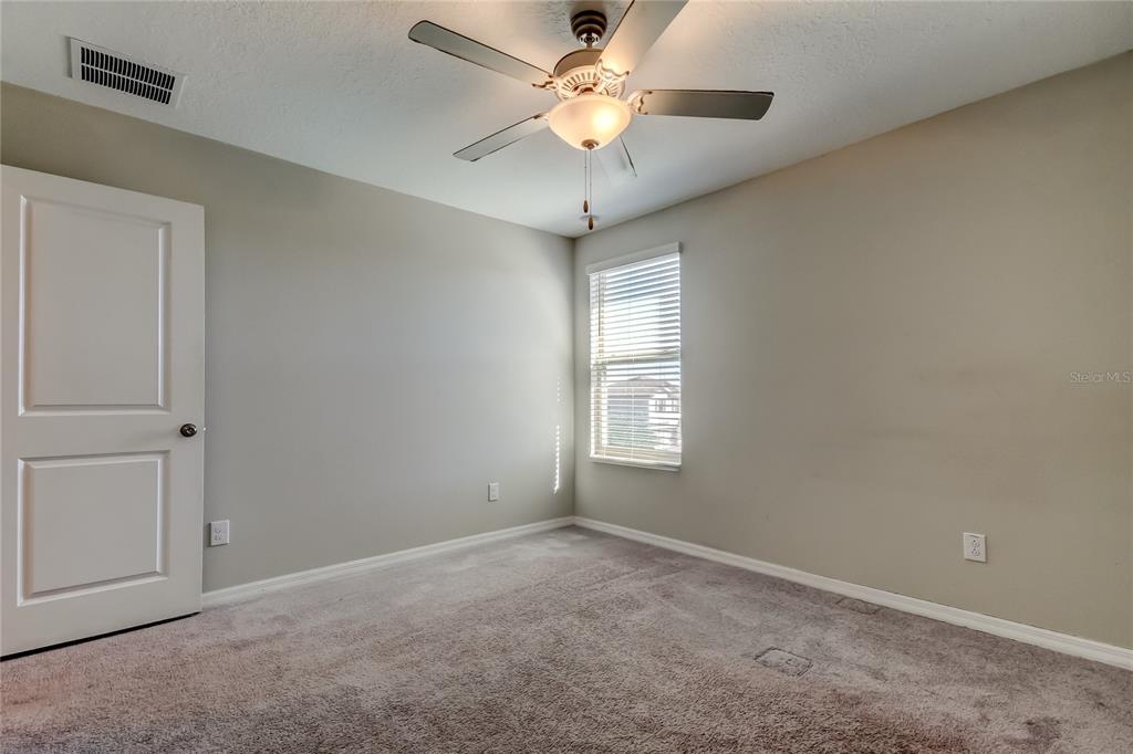 6362 Spider Lily Way New Port Richey, FL 34653 - Photo 38 of 47 a view of an empty room with a window