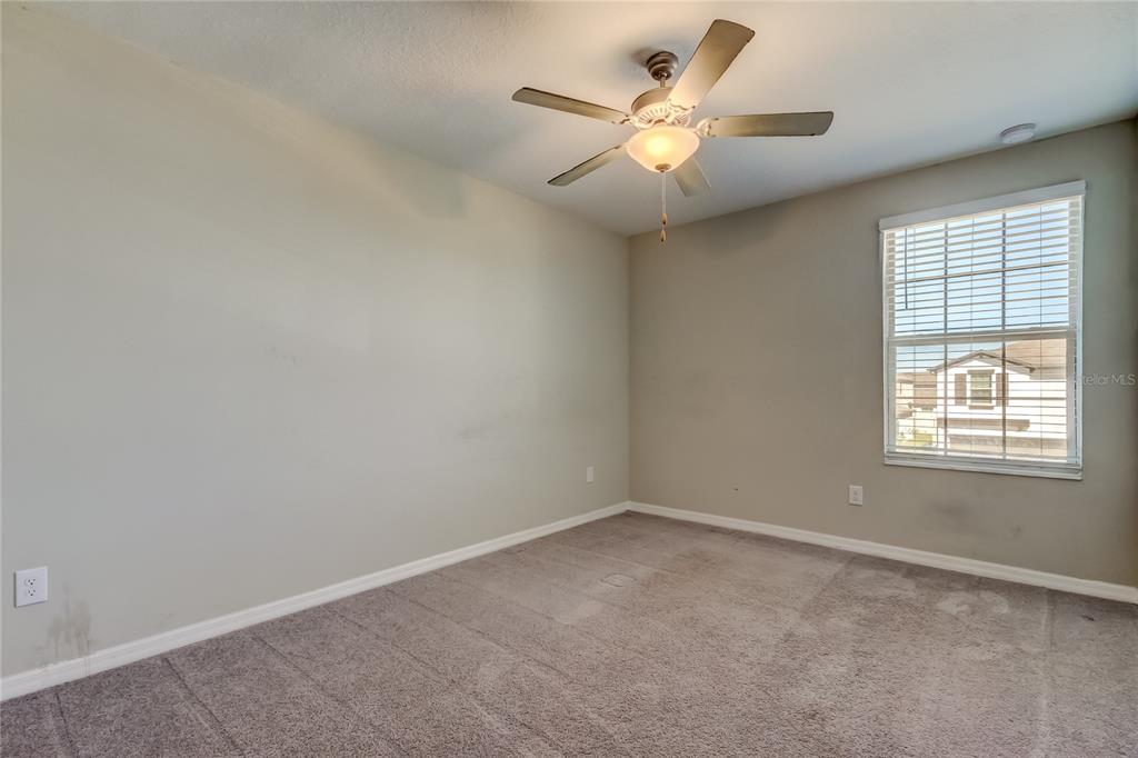 6362 Spider Lily Way New Port Richey, FL 34653 - Photo 44 of 47 an empty room with a window