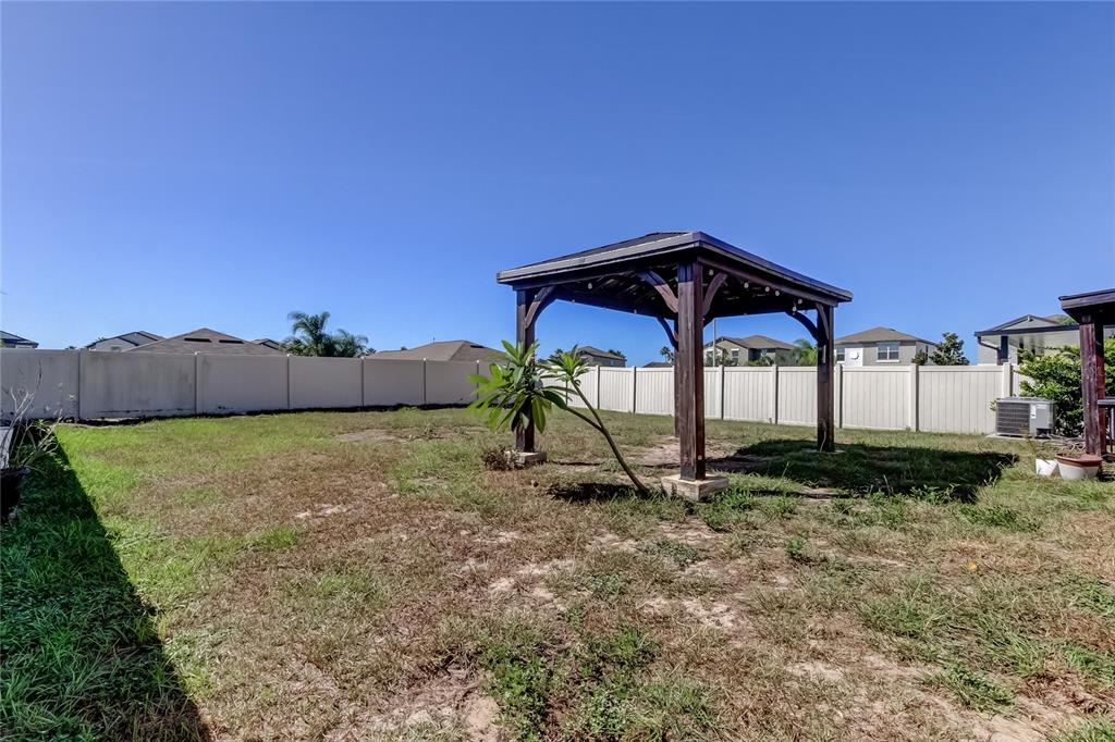 6362 Spider Lily Way New Port Richey, FL 34653 - Photo 45 of 47 a house view with a garden space