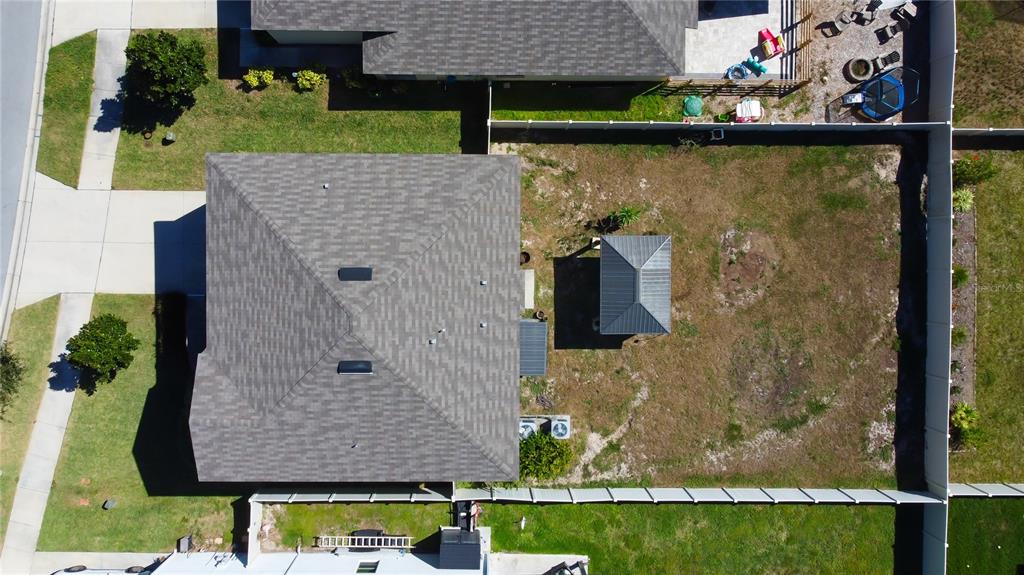 6362 Spider Lily Way New Port Richey, FL 34653 - Photo 7 of 47 an aerial view of a house with a yard and sitting area