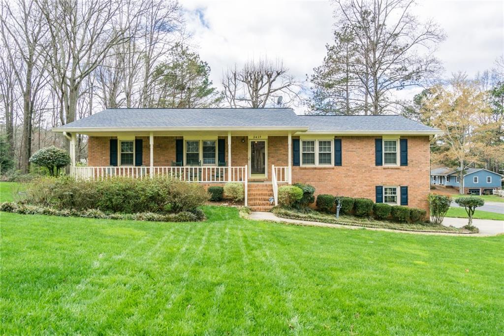 BEAUTIFUL THREE BEDROOM BRICK RANCH WITH LOVELY LAWN